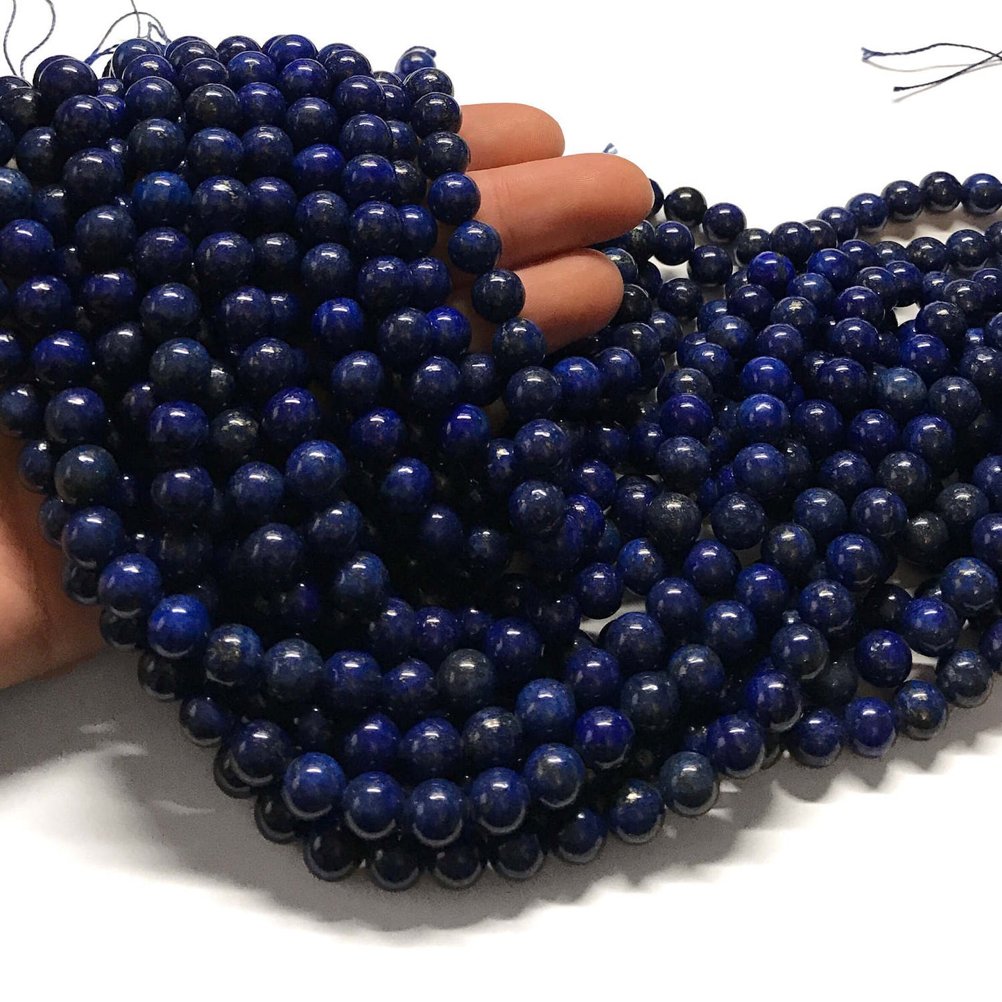 8mm Dark blue lapis lazuli rounds. 15.5 inches long.