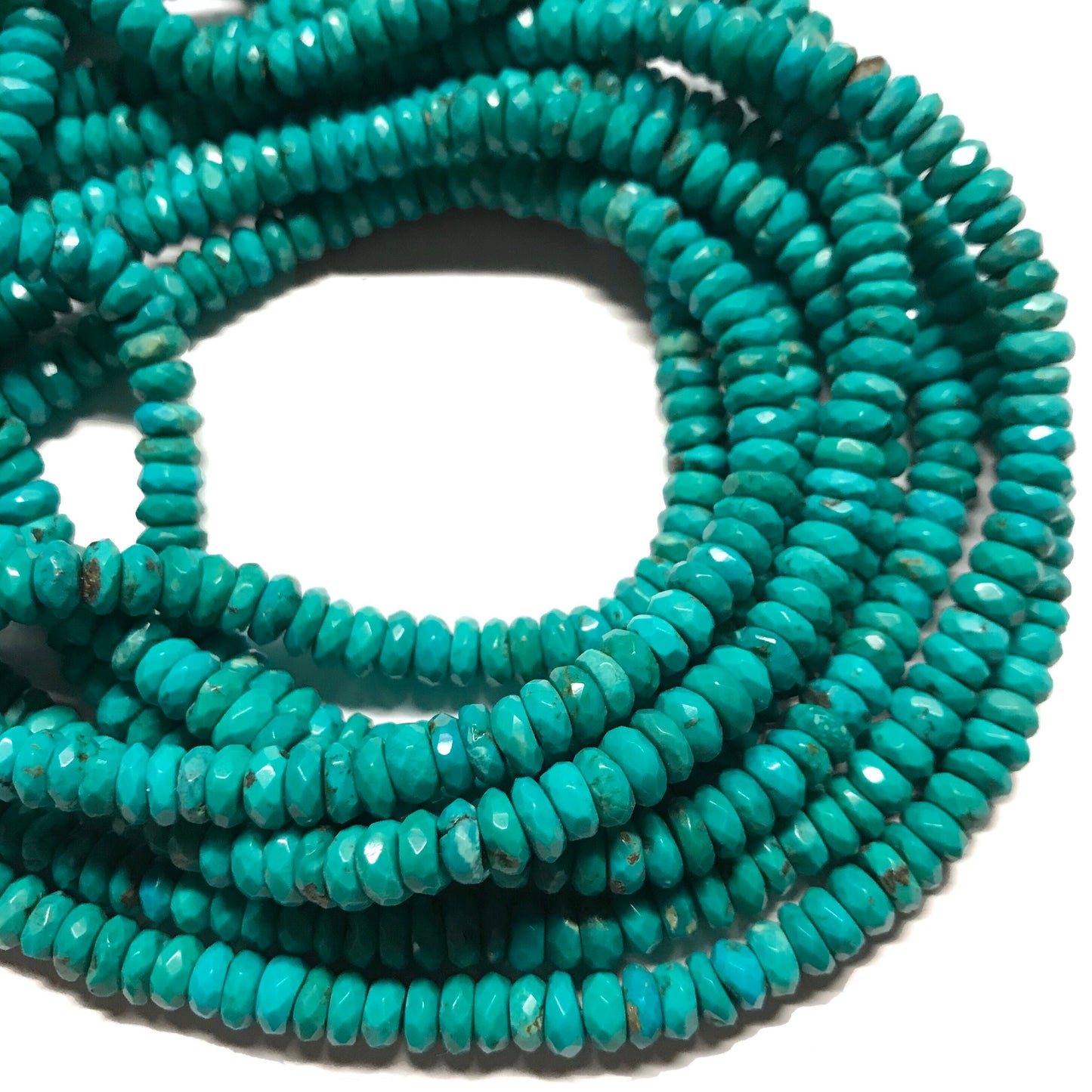 6.5mm Nacozari Turquoise Faceted Rondelles. 15.75 inch strand.