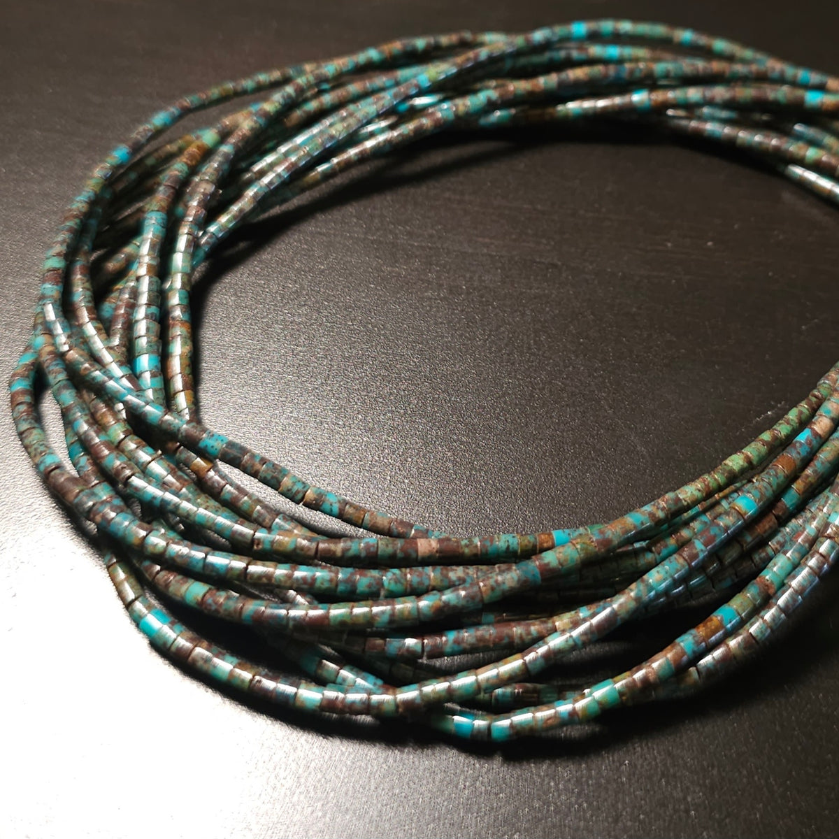 2mm Turquoise Heishi. 16 inch strand.