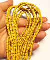 3mm Magnesite tubes, golden yellow, 16 inch strand.