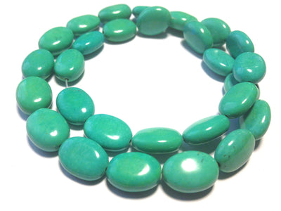 Magnesite ovals, teal blue, 10x14mm per piece, 16 inch strand.