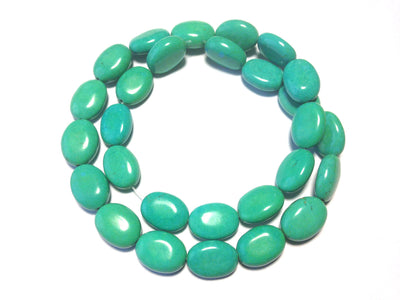 Magnesite ovals, teal blue, 10x14mm per piece, 16 inch strand.