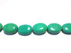 Magnesite ovals, teal blue, 10x14mm per piece, 16 inch strand.