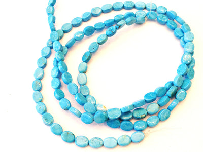 Magnesite ovals, blue, 5x8mm per piece, 16 inch strand.