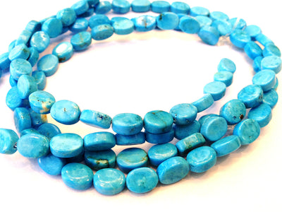 Magnesite ovals, blue, 5x8mm per piece, 16 inch strand.