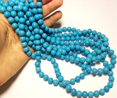 8.5mm Magnesite rounds, blue, 16 inch strand.