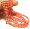 4mm Salmon Pink Bamboo Coral, Faceted Rounds. 16" Strand.