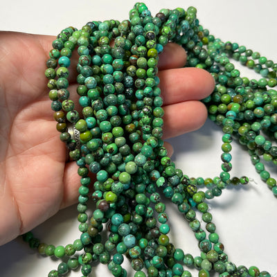 4.2-4.8mm green Chinese Turquoise Rounds. 16 inch strand.