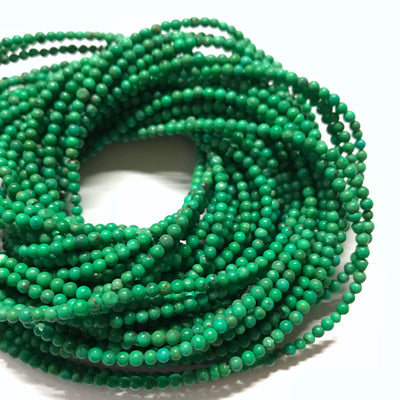 2.4-2.6mm Chinese turquoise rounds, Mojave green turquoise from Anhui. 16 inch strand.