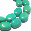 Magnesite ovals, teal blue, 10x14mm per piece, 16 inch strand.