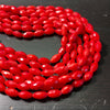 6x10mm Bamboo coral, faceted barrels, true red, 16 inches long